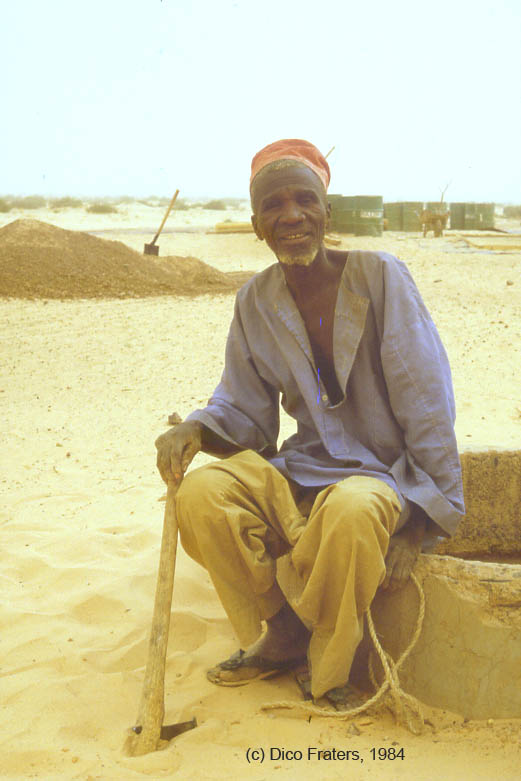 famrer in Niger near a well